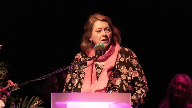 writer Karen J McDonnell, reading at podium in darkened room, for Sunday Miscellany live event at Ennis Book Club Festival, March 2026