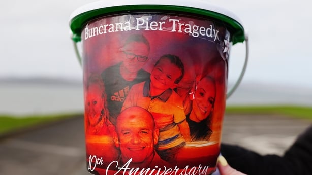 A collection bucket during a remembrance walk in Buncrana 10 years after five members of a family were killed in a pier tragedy
