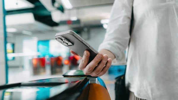 Close-up shot a person making a contactless payment with smartphone