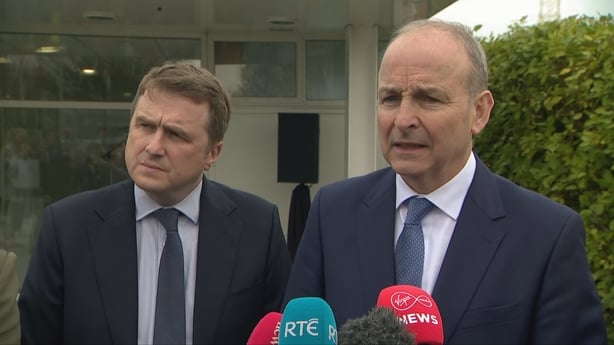 Taoiseach Micheál Martin speaking to press alongside James Browne