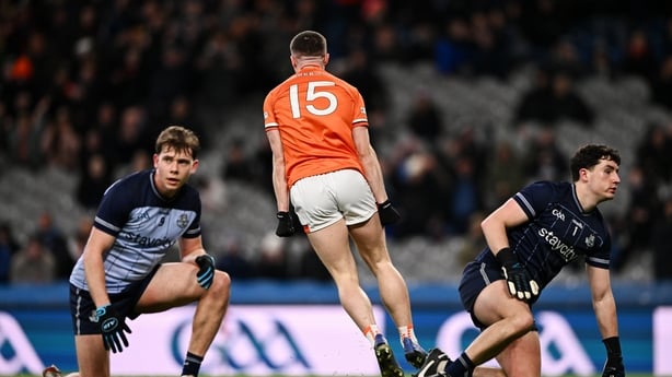 14 March 2026; Oisín Conaty of Armagh, 15, celebrates after scoring his side's second goal, as Charlie McMorrow of Dublin, left, and Dublin goalkeeper Hugh O'Sullivan react, during the Allianz Football League Division 1 match between Dublin and Armagh at Croke Park in Dublin. Photo by Ben McShane/Sp