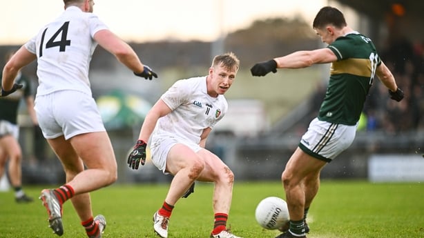 14 March 2026; Ryan O'Donoghue of Mayo can only watch as Seán O'Shea of Kerry kicks a two-pointer off the ground during the Allianz Football League Division 1 match between Kerry and Mayo at Austin Stack Park in Tralee, Kerry. Photo by Piaras Ó Mídheach/Sportsfile