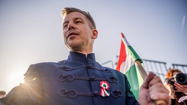 Peter Magyar, leader of the Tisza party, greets supporters during a rally ahead of a general election in Budapest, Hungary, on Sunday, March 15, 2026. Dueling rallies laid bare the division gripping Hungary, with Viktor Orban using Ukraine as the bogeyman in the campaign and Magyar vowing to return 
