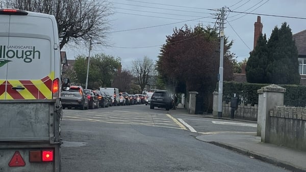 Rear view of queue of cars stuck in traffic