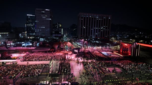 K-pop boy group BTS perform during their concert at Gwanghwamun Square in Seoul on 21 March, 2026. (Photo by Kim Hong-Ji / POOL / AFP)