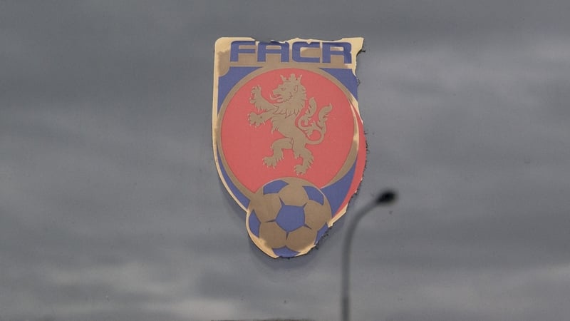 A sticker with the logo of Czech Football Association (FACR) is seen on the entrance door of the FACR headquarters, as the clouds reflect on the surface, in Prague, Czech Republic, on October 16, 2020. - Czech police detained 19 people including deputy Cz