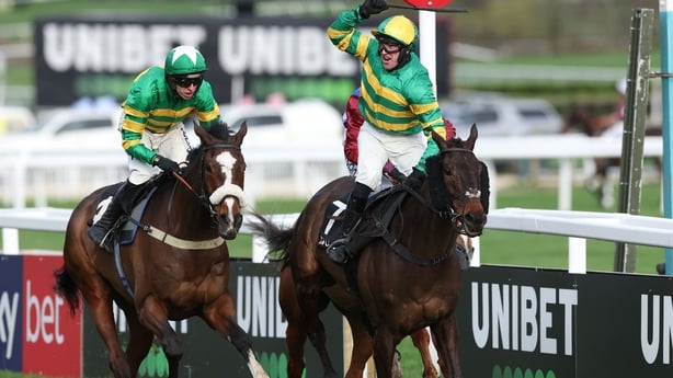 CHELTENHAM, ENGLAND - MARCH 10: R P McLernon riding Johnnywho celebrates winning the Trustmarque Ultima Handicap Chase from Jagwar ridden by Mark Walsh at Cheltenham Racecourse on March 10, 2026 in Cheltenham, England. (Photo by Michael Steele/Getty Images)