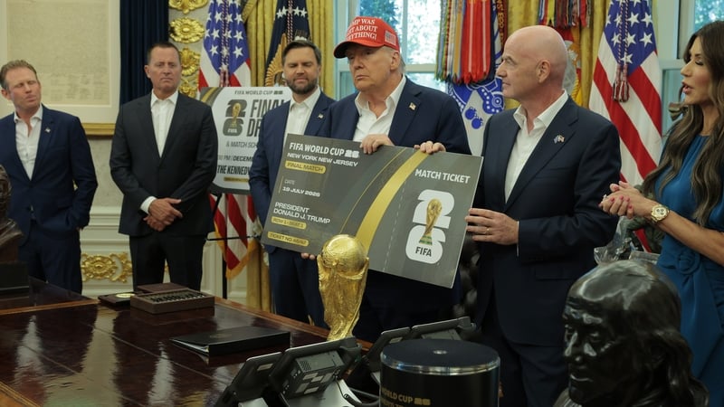 FIFA President Gianni Infantino and US President Donald Trump hold a large World Cup ticket replica in the Oval Office
