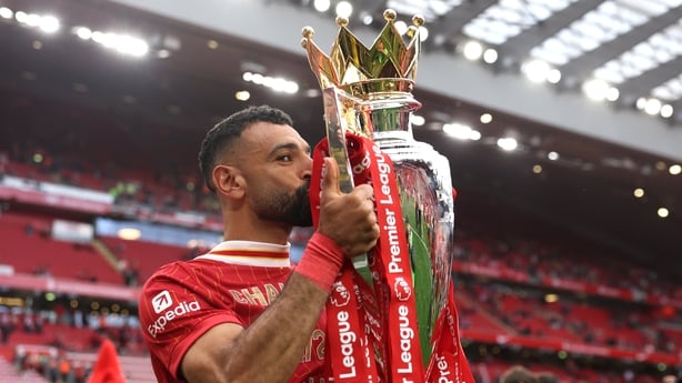 LIVERPOOL, ENGLAND - MAY 25: Mohamed Salah of Liverpool kisses the Premier League trophy, as Liverpool are crowned the Champions of the Premier League for the 2024/25 Season, following the Premier League match between Liverpool FC and Crystal Palace FC at Anfield on May 25, 2025 in Liverpool, Englan