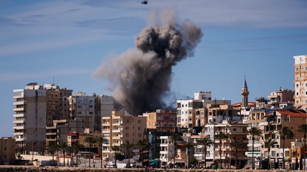 A plume of smoke and a fragment of concrete rise from the site of an Israeli airstrike on the eastern outskirts of Tyre, in southern Lebanon, on March 24, 2026. Lebanon was pulled into the Middle East war when Iran-backed Hezbollah began firing rockets into Israel on March 2 to avenge the killing of