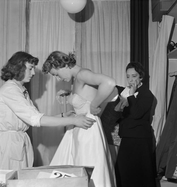 Elsa Schiaparelli with a model at 21 Place Vendome. 