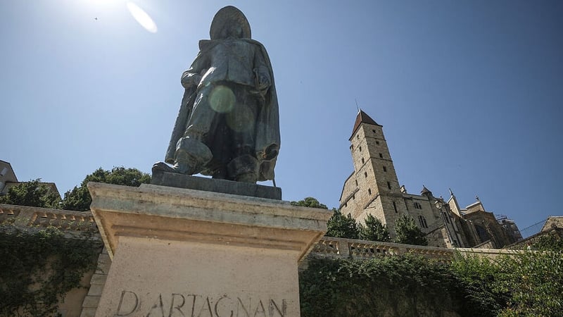 The statue of d'Artagnan is seen in Auch with the Armagnac tower in France