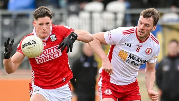 Colm O'Callaghan of Cork in action against Brian Kennedy of Tyrone - 2026 Allianz Football League