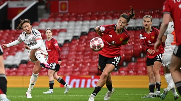 Bayern Munich's Japanese midfielder #18 Momoko Tanikawa (2L) shoots to score Bayern Munich's third goal during the UEFA Women's Champions League, Quarter Final first-leg football match between Manchester United and Bayern Munich at Old Trafford in Manchester, north west England, on March 25, 2025