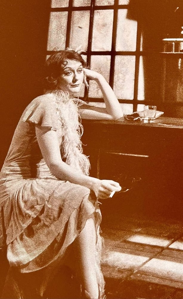 Archive image of Cathy Belton playing a character on stage