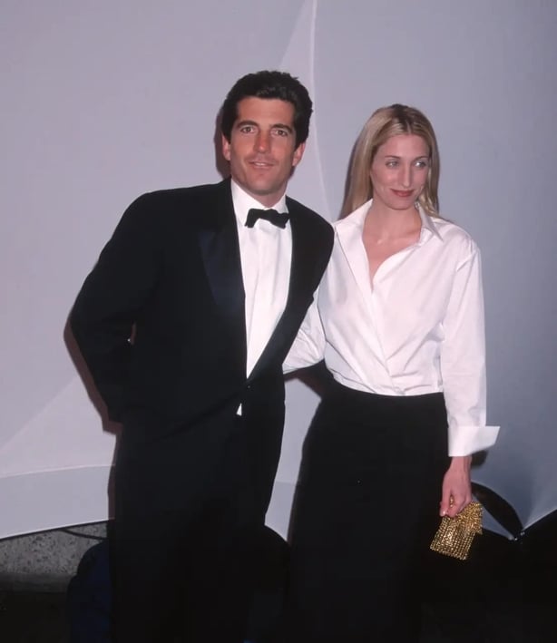 Carolyn Bessette-Kennedy famously styled an oversized men's white shirt with a column pencil skirt and gold bag in 1999
