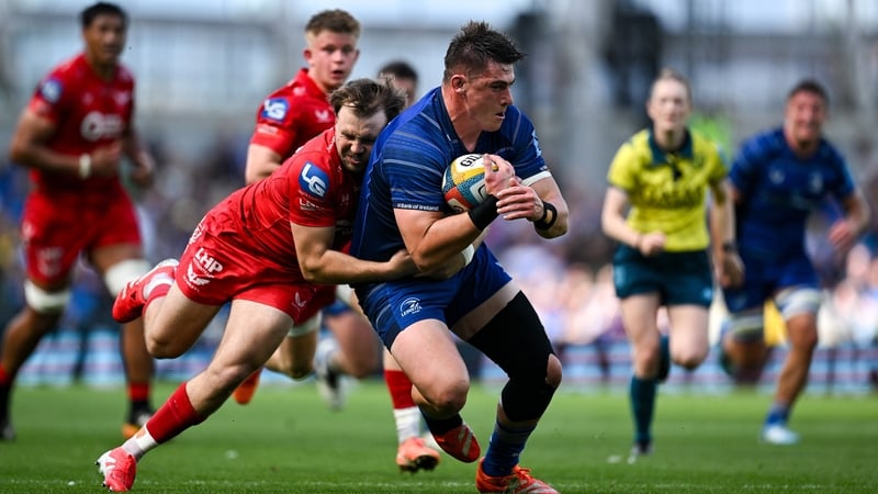 31 May 2025; Dan Sheehan of Leinster is tackled by Ioan Lloyd of Scarlets in the lead up to his side's fourth try during the United Rugby Championship quarter-final match between Leinster and Scarlets at the Aviva Stadium in Dublin. Photo by Brendan Moran
