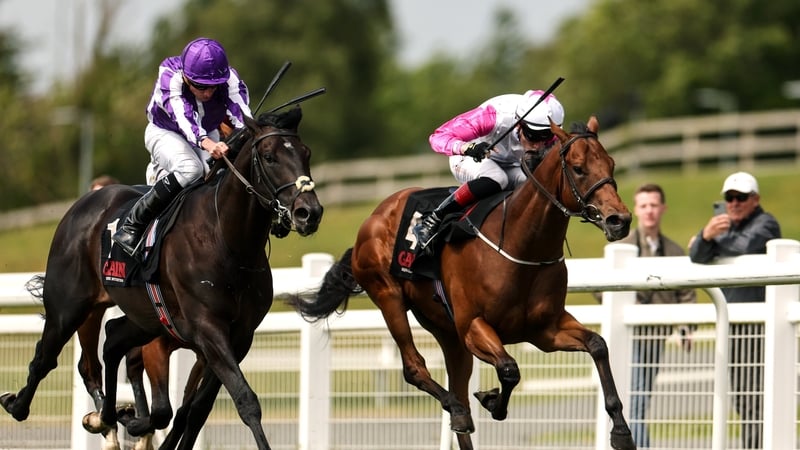 Albert Einstein, with Ryan Moore up (left) on their way to winning the Marble Hill Stakes at the Curragh, May 2025