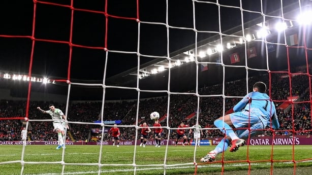 Troy Parrott of Republic of Ireland shoots to score his side's first goal, a penalty, during the FIFA World Cup 2026 European Qualifiers play-off semi-final match between Czechia and Republic of Ireland at Fortuna Arena in Prague, Czechia.