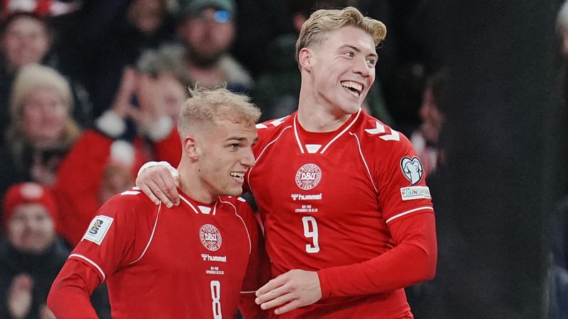 Denmark's forward #08 Gustav Isaksen (L) celebrates scoring his team's second goal with Denmark's forward #09 Rasmus Hojlund during the FIFA World Cup 2026 European qualification semi-final football match between Denmark and North Macedonia in Copenhagen