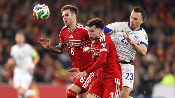 CARDIFF, WALES - MARCH 26: Neco Williams and Joe Rodon of Wales battle for possession with Haris Tabakovic during the FIFA World Cup 2026 European Qualifiers KO play-off match between Wales and Bosnia and Herzegovina at Cardiff City Stadium on March 26, 2026 in Cardiff, Wales. (Photo by Warren Littl