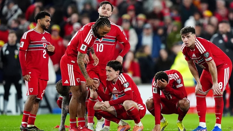 Wales' Harry Wilson (centre) and team-mates react after losing the penalty shoot-out during the 2026 FIFA World Cup European Play-off Semi-final match at the Cardiff City Stadium. Picture date: Thursday March 26, 2026.