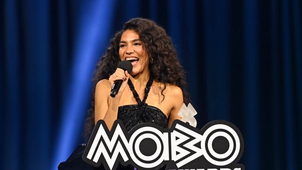 MANCHESTER, ENGLAND - MARCH 26: Olivia Dean wins Album Of The Year For 'The Art Of Loving' onstage during the 2026 MOBO Awards at Co-op Live on March 26, 2026 in Manchester, England. (Photo by Joseph Okpako/Getty Images for MOBO)