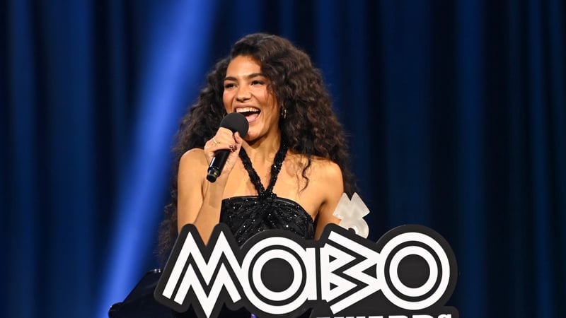 MANCHESTER, ENGLAND - MARCH 26: Olivia Dean wins Album Of The Year For 'The Art Of Loving' onstage during the 2026 MOBO Awards at Co-op Live on March 26, 2026 in Manchester, England. (Photo by Joseph Okpako/Getty Images for MOBO)