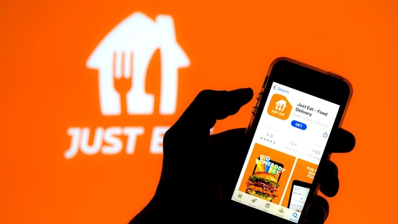 SPAIN - 2021/04/29: In this photo illustration a Just Eat app in App Store seen displayed on a smartphone screen with a Just Eat logo in the background. (Photo Illustration by Thiago Prudencio/SOPA Images/LightRocket via Getty Images)