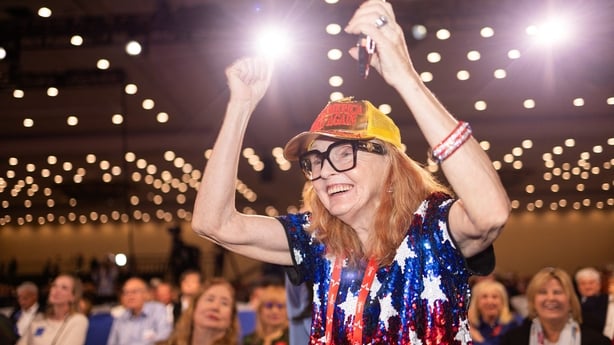 A woman wearing MAGA paraphernalia cheers during the Conservative Political Action Conference (CPAC) in Grapevine northwest of Dallas, Texas