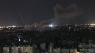 Smoke rises from the site of an Israeli airstrike that targeted an area in Beirut’s southern suburbs