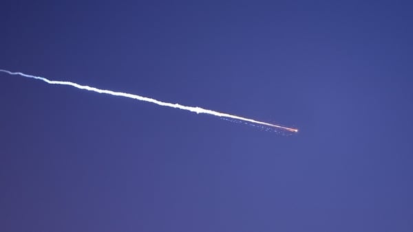 Rocket trails are seen in the sky above the Israeli coastal city of Netanya amid a fresh barrage of Iranian missile attacks on March 28, 2026. Emergency responders said a man was killed in Israel on March 28 after the Israeli military reported missiles fi