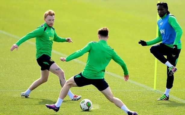 Bosun Lawal, right, with Liam Scales, left, and Johnny Kenny during a Republic of Ireland men's training session at the FAI National Training Centre in Abbotstown, Dublin.