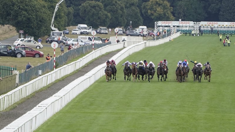 DONCASTER, ENGLAND - SEPTEMBER 10: A general view as runners 
 make their way down the track in The Coopers Marquees Maiden Stakes at Doncaster Racecourse on September 10, 2021 in Doncaster, England. (Photo by Alan Crowhurst/Getty Images)