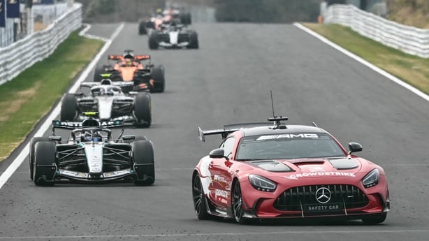 The safety car leads drivers following a crash by Haas F1 Team's British driver Oliver Bearman during the Formula One Japanese Grand Prix at the Suzuka circuit in Suzuka, Mie prefecture on March 29, 2026.