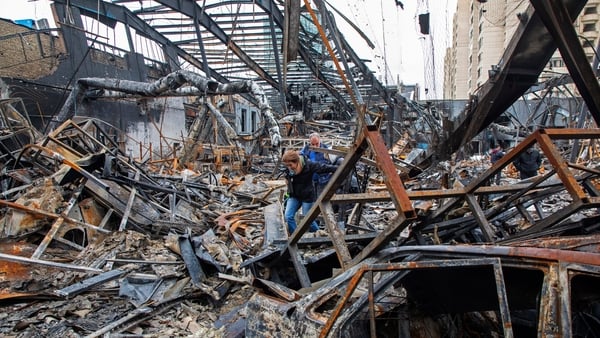 TEHRAN, IRAN - MARCH 28: Journalists walk through the rubble of a foreign car repair workshop that was damaged during a joint U.S. and Israeli attack on March 28, 2026 in Tehran, Iran. The United States and Israel have continued their joint attack on Iran