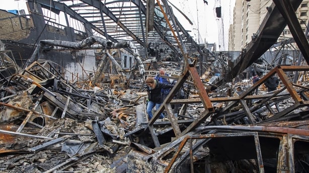 TEHRAN, IRAN - MARCH 28: Journalists walk through the rubble of a foreign car repair workshop that was damaged during a joint U.S. and Israeli attack on March 28, 2026 in Tehran, Iran. The United States and Israel have continued their joint attack on Iran that began on February 28. Iran retaliated b