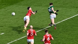 29 March 2026; Jack O'Connor of Meath scores his side's first goal despite the attention of Maurice Shanley of Cork during the Allianz Football League Division 2 final match between Meath and Cork at Croke Park in Dublin. Photo by Ramsey Cardy/Sportsfile