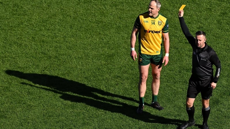 29 March 2026; Michael Murphy of Donegal is shown a yellow card by referee David Gough during the Allianz Football League Division 1 final match between Kerry and Donegal at Croke Park in Dublin. Photo by Ramsey Cardy/Sportsfile