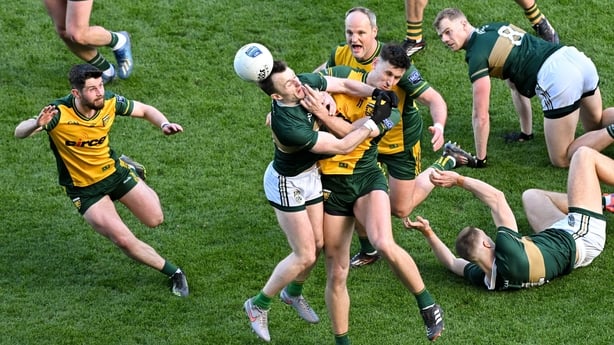 Kerry's Tom O'Sullivan, right, and Michael Langan of Donegal compete for possession