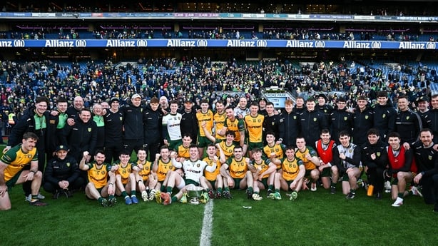 Donegal players and management celebrate with the Corn Mhíchíl Uí Mhuircheartaigh
