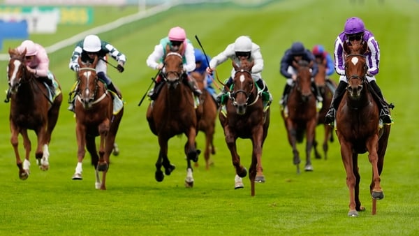 NEWMARKET, ENGLAND - OCTOBER 10: Christophe Soumillon riding Precise (R, purple) win The bet365 Fillies' Mile at Newmarket Racecourse on October 10, 2025 in Newmarket, England. (Photo by Alan Crowhurst/Getty Images)