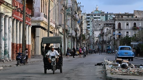 vehicles are seen on a street in havana