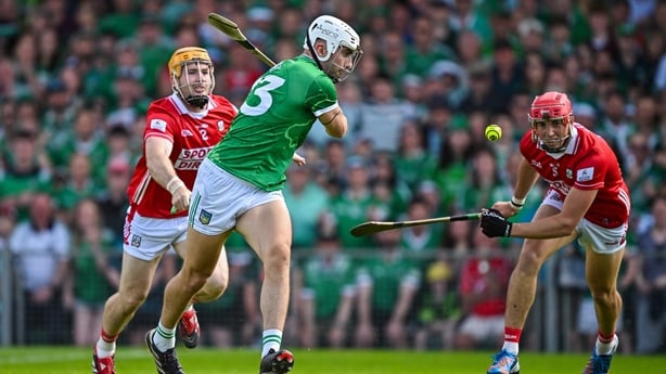 Niall O'Leary, left, gives chase to Limerick's Aaron Gillane during the 2025 Munster round-robin clash