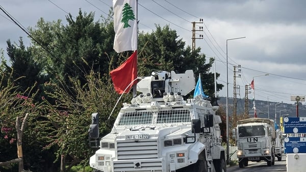 United Nations peacekeepers with the UN Interim Force in Lebanon drive past a Lebanese army outpost in the area of Naqura in southern Lebanon