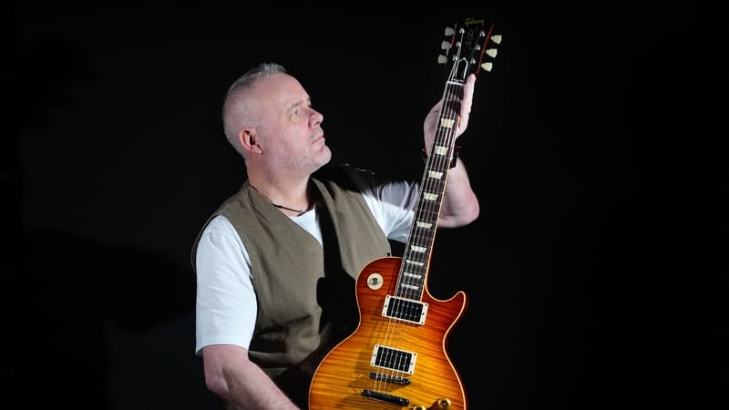 Propstore's music specialist Mark Hochman holds Slash's Guns N' Roses photo-matched tour stage used and autographed Gibson Les Paul '59 custom shop guitar (est. �150,000 - �300,000) during a photocall for the upcoming Music Live Auction, at the Propstore