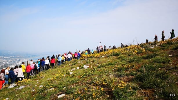 People walking up a hill