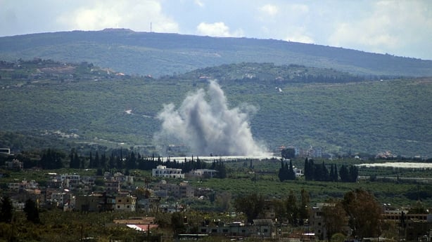 A photograph taken from the southern coastal city of Tyre shows smoke rising from the site of an Israeli airstrike that targeted the village of El-Mansouri 