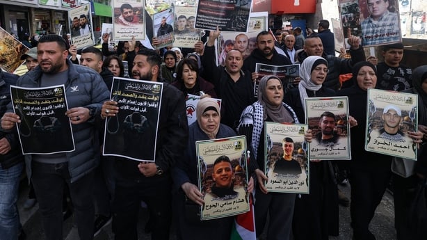 Relatives of Palestinian prisoners are pictured during a rally in the Israeli-occupied West Bank city of Nablus against the bill