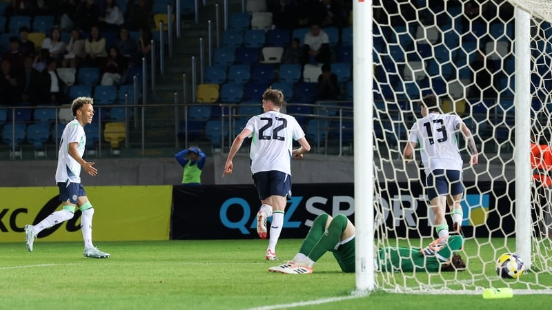 Oisin Gallagher of Republic of Ireland, centre, runs to celebrate with teammates Trent Kone-Doherty, left, and Sean Patton after scoring his side's first goal during the UEFA European U21 Championship qualifier match between Kazakhstan and Republic of Ire